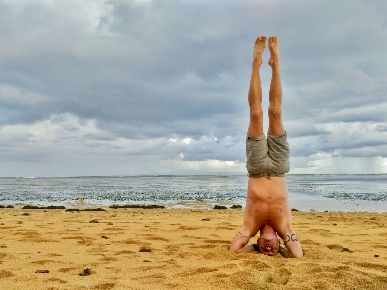 The Headstand on a beach. Photo by Rob Hourmont