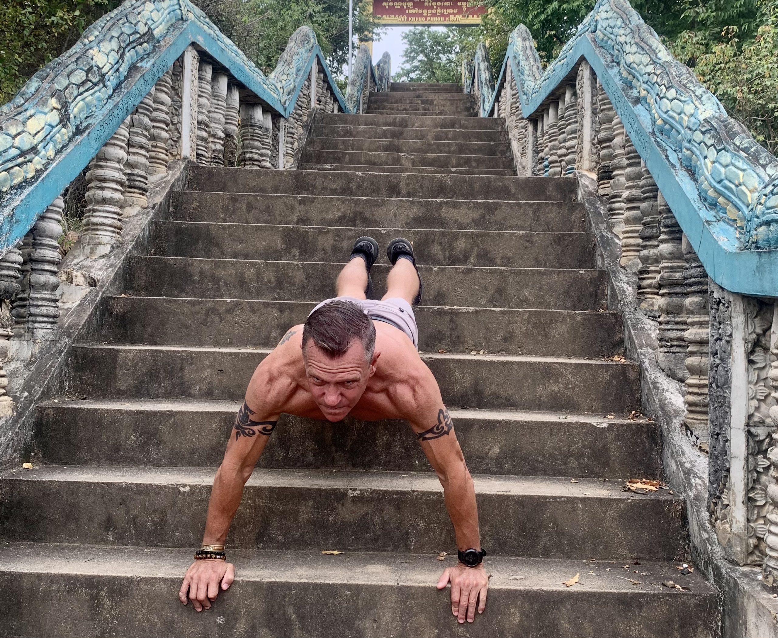 Incline push-ups on steep steps. That's how you get and stay fit. Not in the gym! Photo by Rob Hourmont
